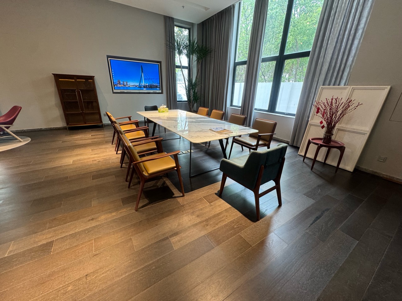A wider view of tables, chairs and their surroundings